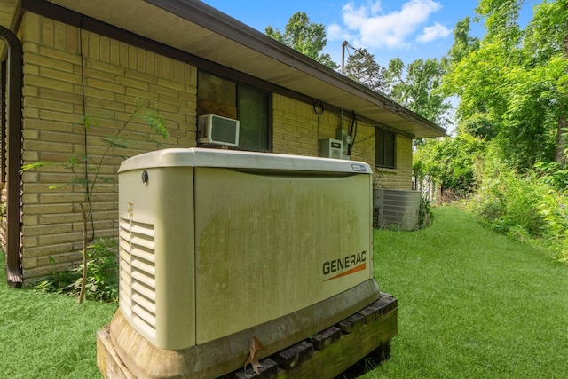 details featuring a power unit, brick siding, and cooling unit