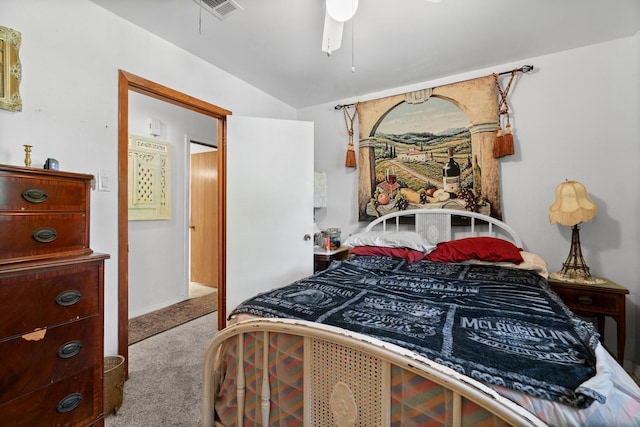 bedroom featuring visible vents, carpet flooring, and vaulted ceiling