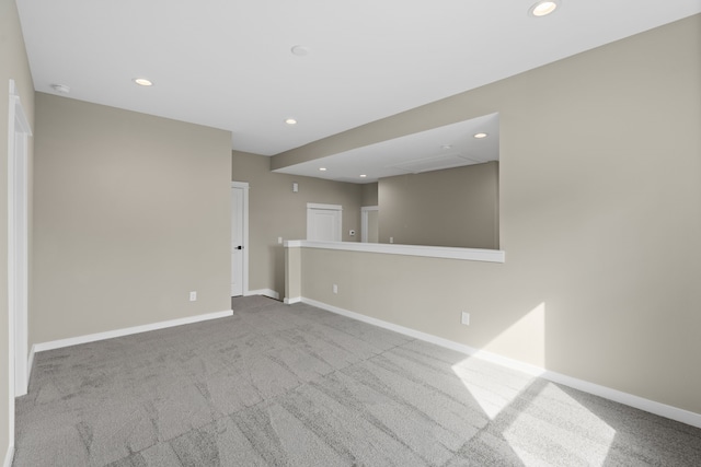 spare room with carpet flooring, recessed lighting, and baseboards