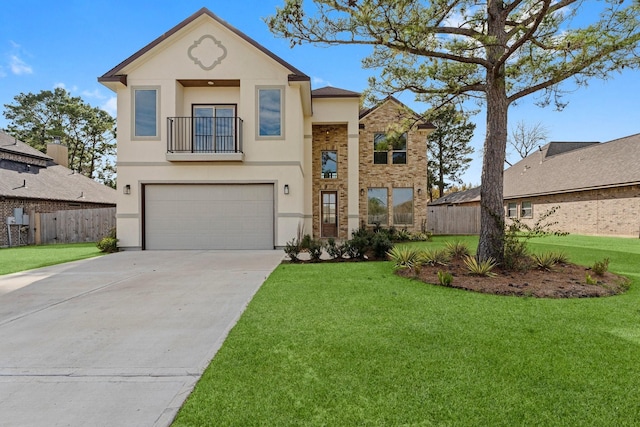 traditional-style house featuring a front yard, fence, a balcony, an attached garage, and stucco siding