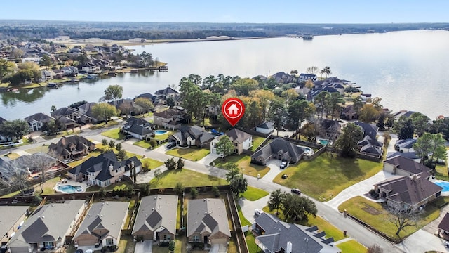 bird's eye view featuring a water view and a residential view