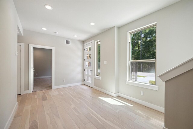 540 Janisch Rd Unit F, Houston, TX 77018 - spare room featuring visible vents, recessed lighting, baseboards, and light wood-type flooring