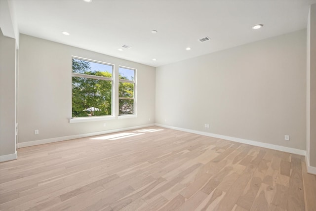 540 Janisch Rd Unit F, Houston, TX 77018 - unfurnished room with light wood-style floors, baseboards, and visible vents