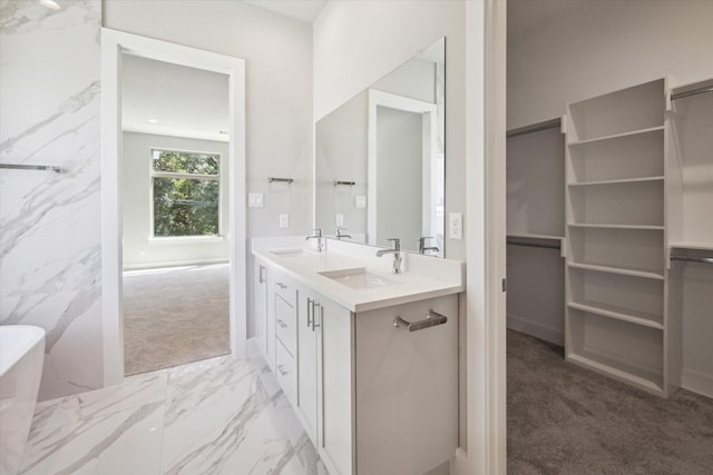 540 Janisch Rd Unit F, Houston, TX 77018 - bathroom featuring double vanity, a soaking tub, a sink, and marble finish floor