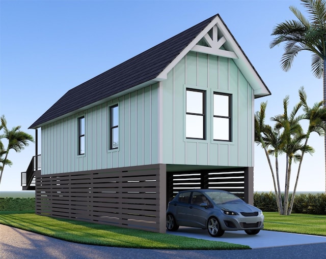 1411 30th St, Galveston, TX 77550 - view of home's exterior with a carport, board and batten siding, and a shingled roof