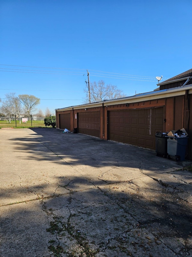 garage with fence