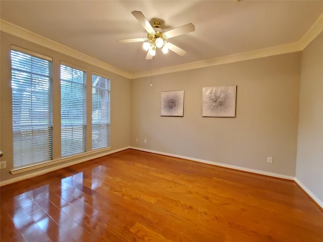5439 Emerald Pointe Ln, Sugar Land, TX 77479 - spare room with a ceiling fan, baseboards, ornamental molding, and wood finished floors