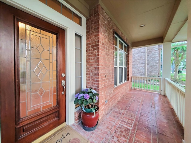 5439 Emerald Pointe Ln, Sugar Land, TX 77479 - entrance to property featuring a porch and brick siding