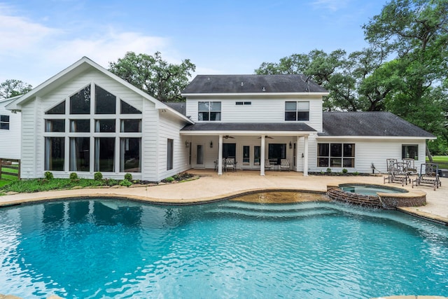 view of pool featuring a patio, ceiling fan, and a pool with connected hot tub
