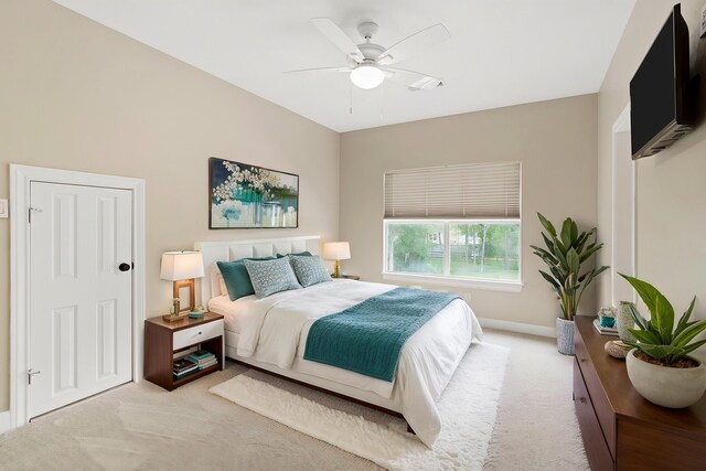 bedroom with baseboards, carpet flooring, and ceiling fan