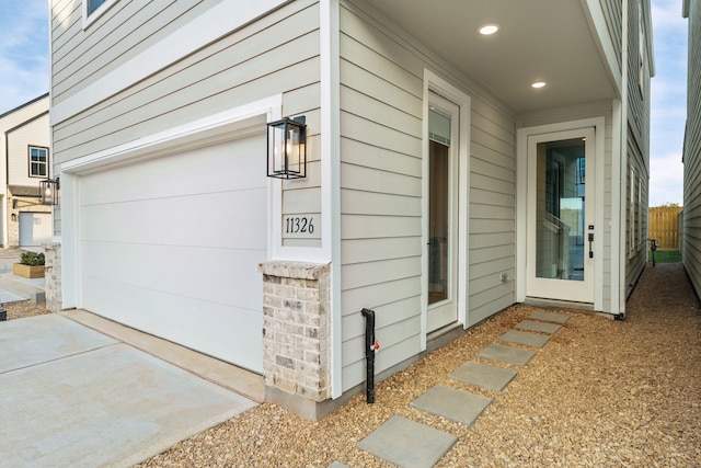 exterior space featuring a garage and fence