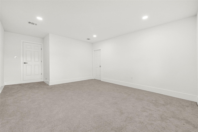 unfurnished room with baseboards, carpet, recessed lighting, and visible vents