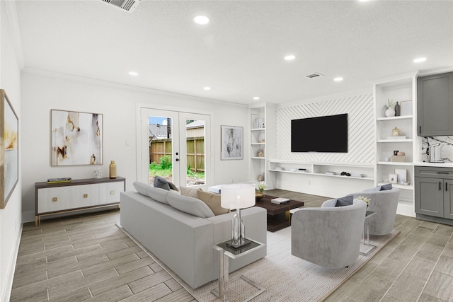 living room with visible vents, ornamental molding, wood finish floors, recessed lighting, and french doors