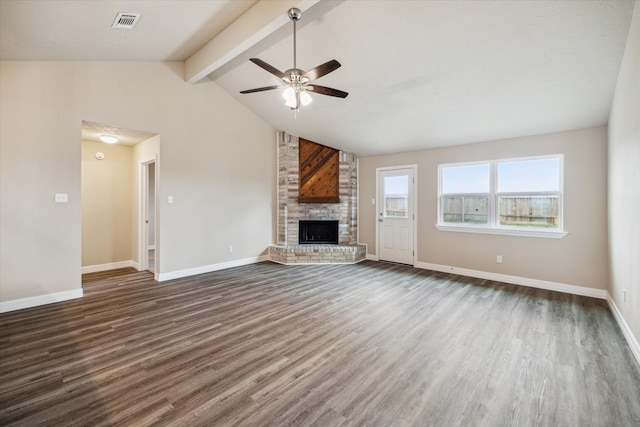 unfurnished living room featuring ceiling fan, a brick fireplace, dark wood finished floors, and visible vents