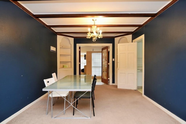 dining room featuring baseboards, an inviting chandelier, beam ceiling, and carpet