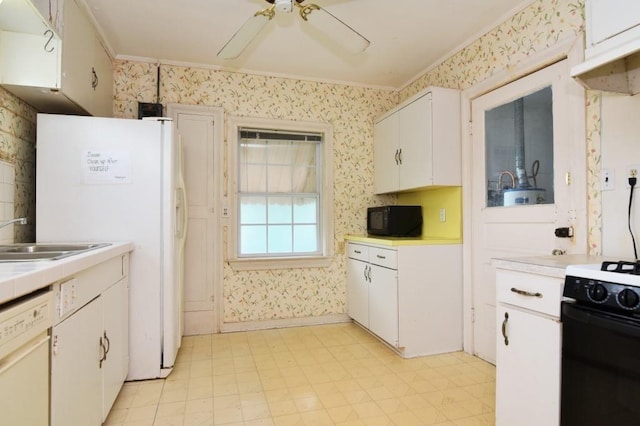 kitchen with light floors, ornamental molding, wallpapered walls, and white appliances
