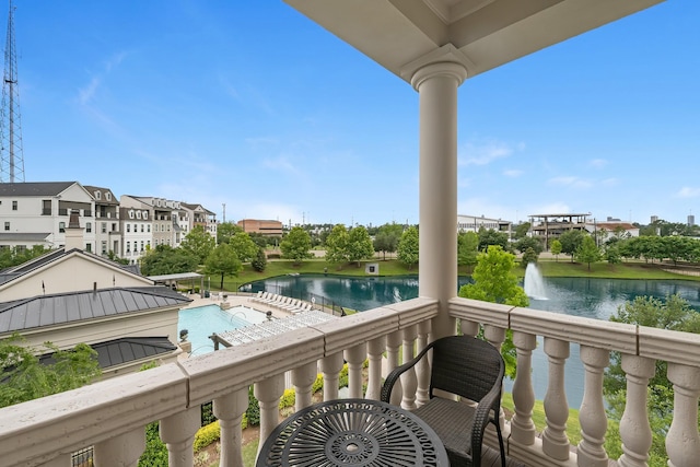 balcony featuring a water view
