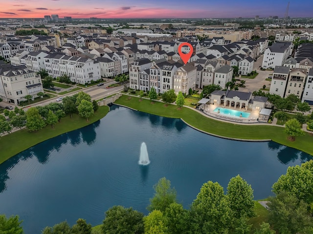 aerial view at dusk with a water view