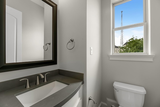 bathroom with toilet and vanity