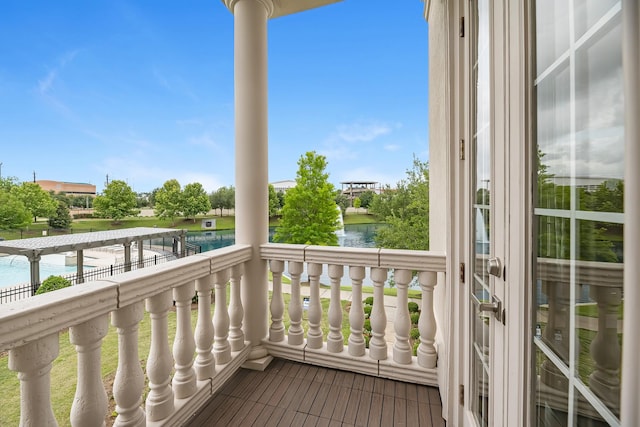 balcony featuring a water view