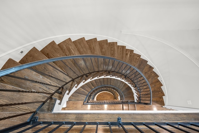 staircase featuring hardwood / wood-style flooring