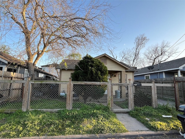 exterior space featuring a gate and a fenced front yard