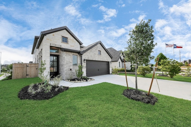 4166 Colony Ln, Missouri City, TX 77459 - french country inspired facade with concrete driveway, brick siding, and a garage