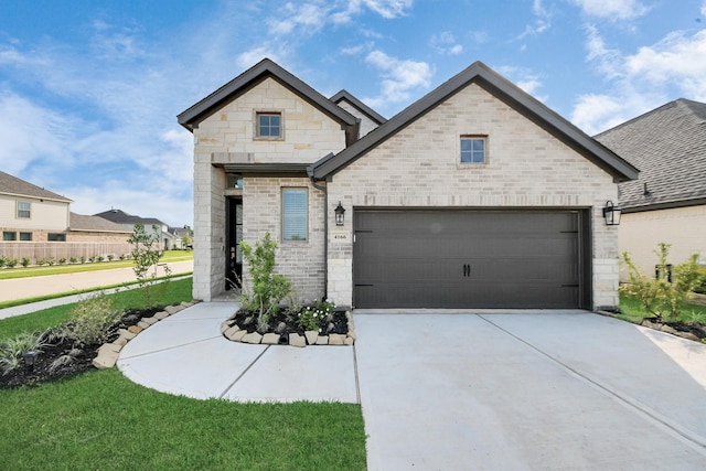4166 Colony Ln, Missouri City, TX 77459 - french country style house with driveway, stone siding, brick siding, and a garage