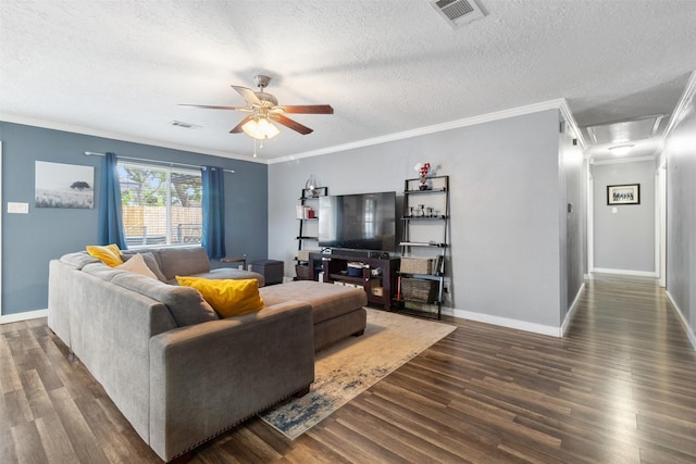 living area featuring a ceiling fan, dark wood-style flooring, a textured ceiling, and visible vents