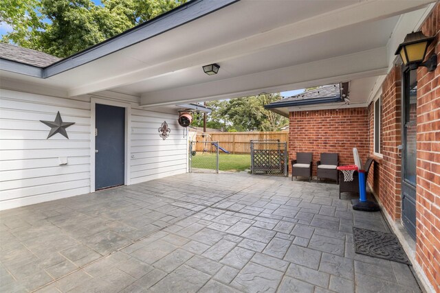 view of patio / terrace with fence
