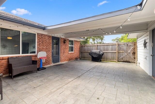 view of patio / terrace with fence and area for grilling