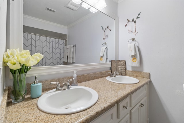 full bath featuring visible vents, ornamental molding, and a sink