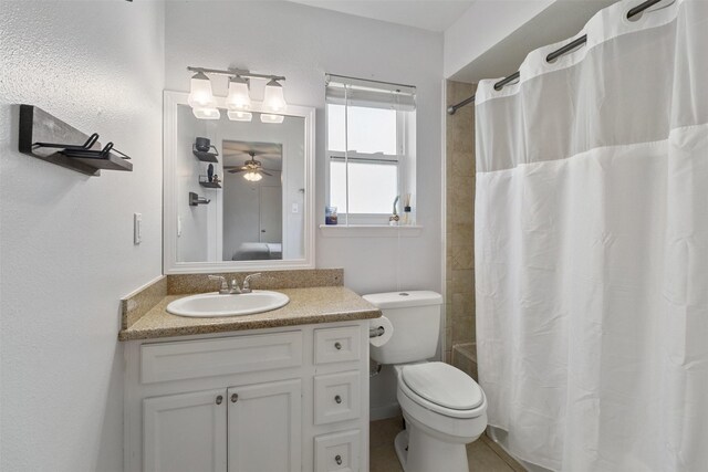 full bathroom with vanity, shower / bath combo, and toilet
