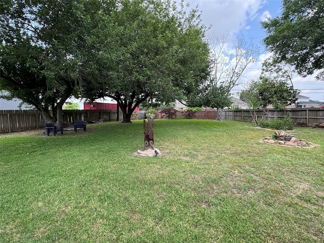 view of yard with a fenced backyard