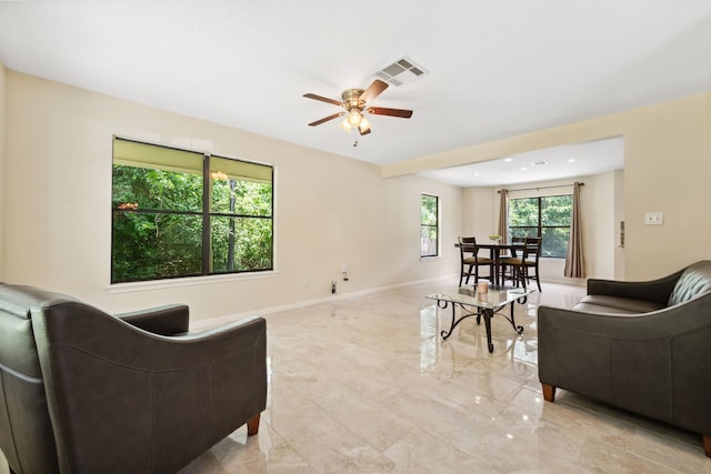 40206 Colfax Rd, Magnolia, TX 77354 - living area with ceiling fan, light marble finish flooring, baseboards, and recessed lighting