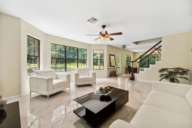 40206 Colfax Rd, Magnolia, TX 77354 - living room with healthy amount of natural light, stairway, and baseboards