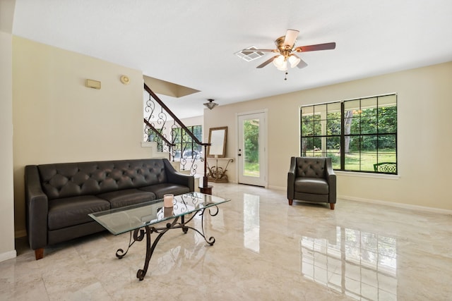 40206 Colfax Rd, Magnolia, TX 77354 - living room featuring ceiling fan, stairway, and baseboards