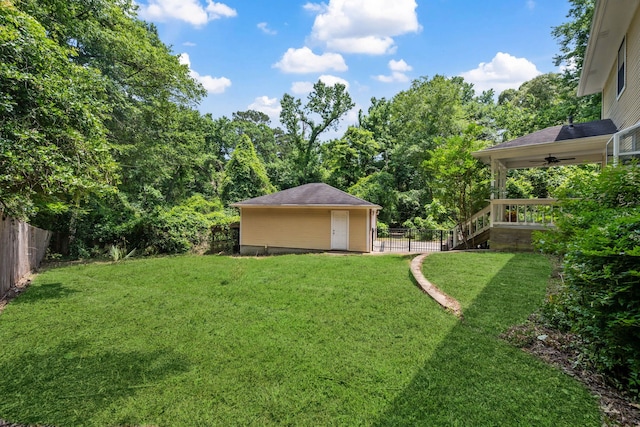 40206 Colfax Rd, Magnolia, TX 77354 - view of yard with an outdoor structure and a ceiling fan