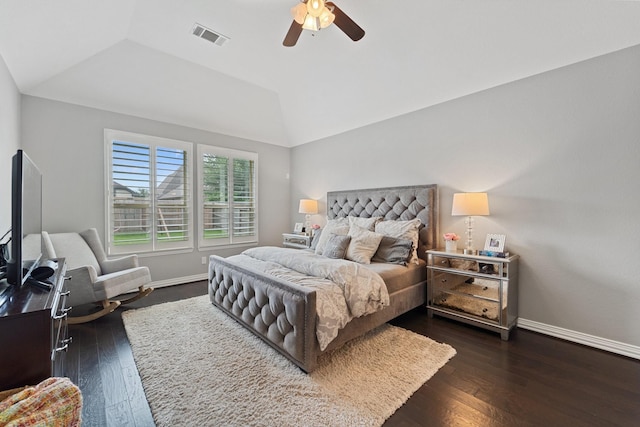 bedroom with ceiling fan, visible vents, baseboards, dark wood-style floors, and lofted ceiling