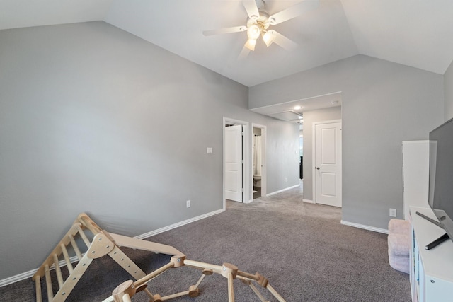 bedroom featuring carpet floors, a ceiling fan, baseboards, and vaulted ceiling