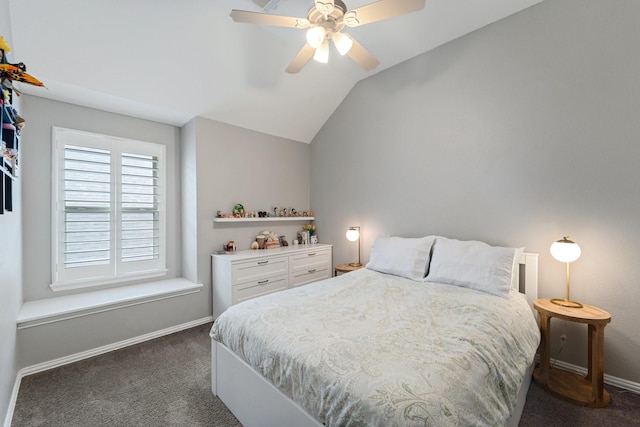 bedroom featuring baseboards, ceiling fan, dark carpet, and lofted ceiling