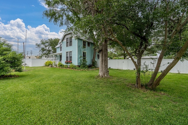 view of yard with fence
