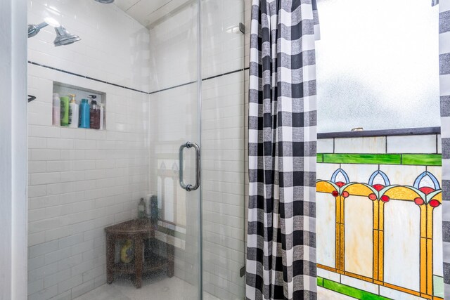 bathroom featuring a shower stall