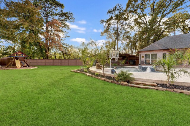 view of yard featuring a playground and fence
