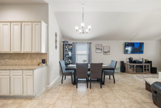 dining room with an inviting chandelier and light tile patterned flooring