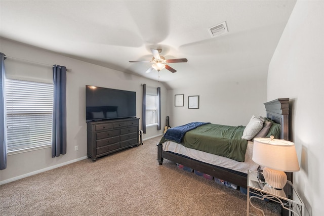 bedroom featuring baseboards, light carpet, and visible vents