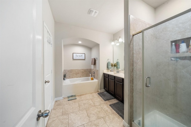bathroom with vanity, tile patterned floors, visible vents, and a stall shower