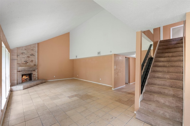 4027 Brookhead Trl, Houston, TX 77066 - unfurnished living room featuring a fireplace, high vaulted ceiling, stairs, baseboards, and light tile patterned floors