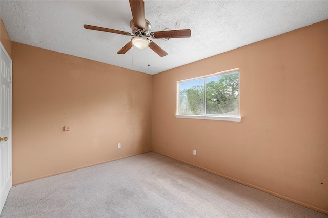 4027 Brookhead Trl, Houston, TX 77066 - carpeted spare room featuring baseboards, a ceiling fan, and a textured ceiling