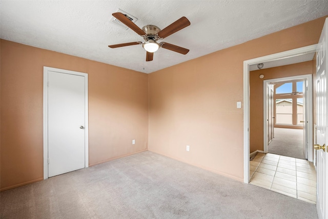 4027 Brookhead Trl, Houston, TX 77066 - unfurnished room with baseboards, a ceiling fan, carpet flooring, and a textured ceiling
